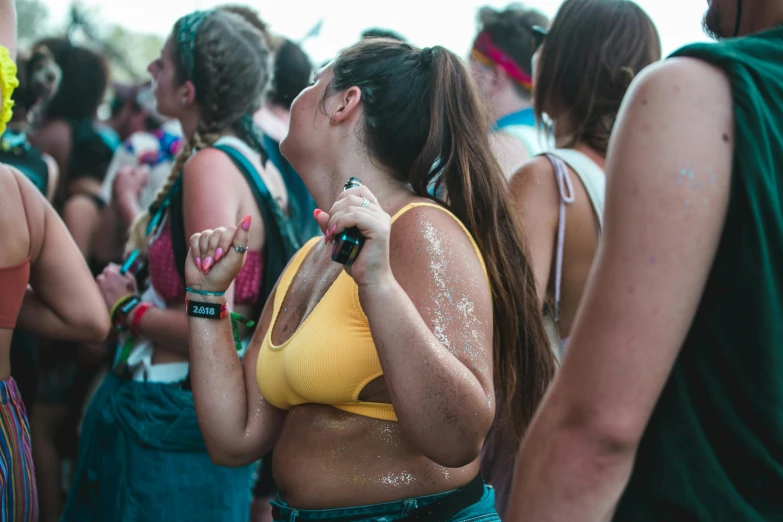 a group of people standing next to each other, by Adam Marczyński, trending on unsplash, graffiti, a person at a music festival, sweaty wet skin, fat latin woman dancing, seapunk