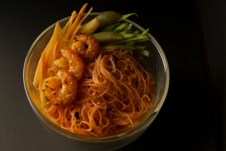 a close up of a bowl of food on a table, in front of a black background, long wispy tentacles, promo image, taejune kim