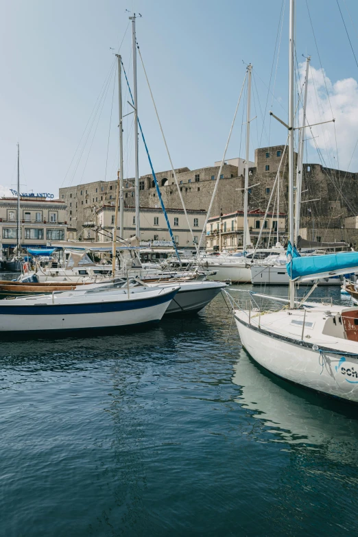 a number of boats in a body of water, a photo, by Carlo Martini, pexels contest winner, renaissance, naples, slim aarons, 3/4 front view, citadel