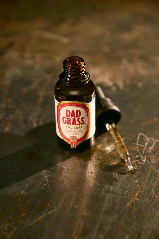 a bottle of beer sitting on top of a table, dada, red grass, dipstick tail, professionally post-processed, dabbing