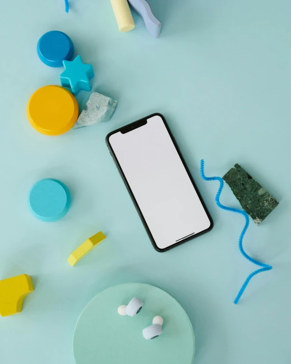 a cell phone sitting on top of a table, trending on pexels, art toys on a pedestal, skincare, material design, product introduction photo