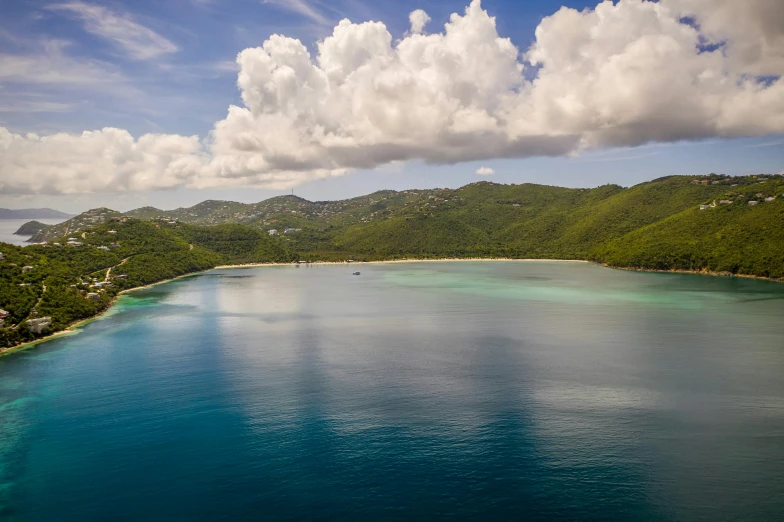 a large body of water next to a lush green hillside, a photo, carribean white sand, mid air shot, fan favorite, multiple stories