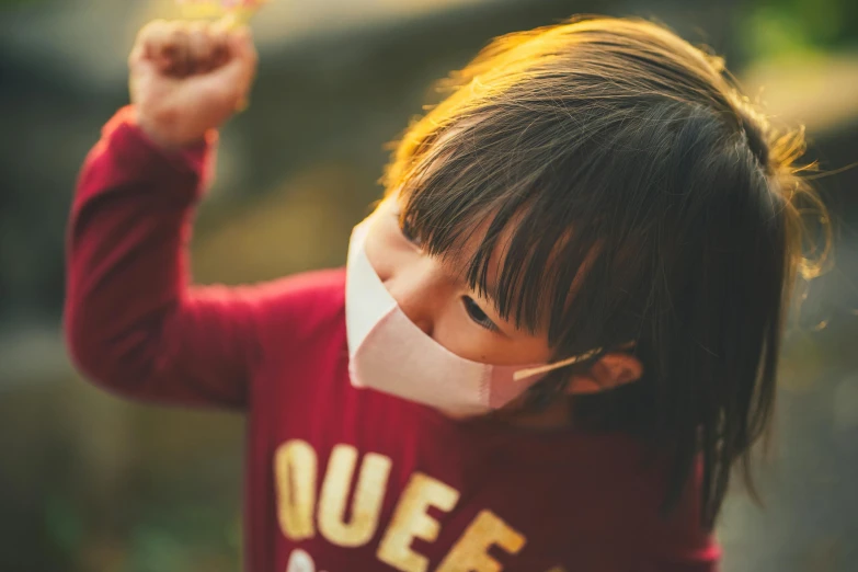 a close up of a child wearing a face mask, pexels contest winner, lovely queen, celebrating, cut, instagram post