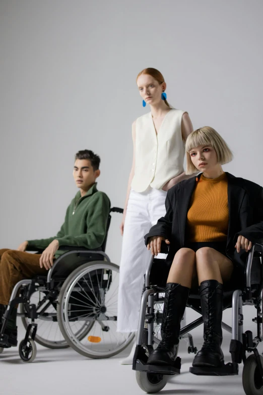 a woman sitting in a wheel chair next to a man in a wheelchair, inspired by Tadashi Nakayama, model エリサヘス s from acquamodels, curated collections, real human, gen z