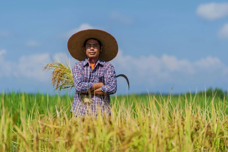 a man with a straw hat standing in a field, by Dan Content, sumatraism, portrait image