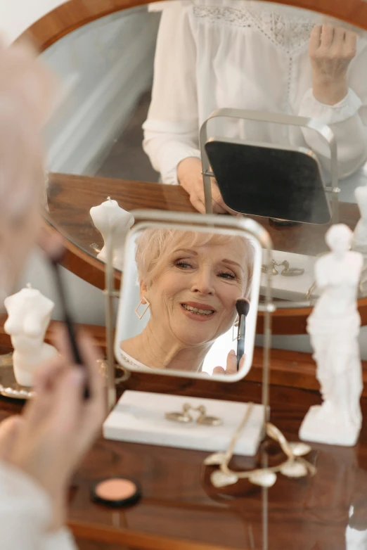 a woman that is standing in front of a mirror, white haired lady, putting makeup on, profile image, elderly