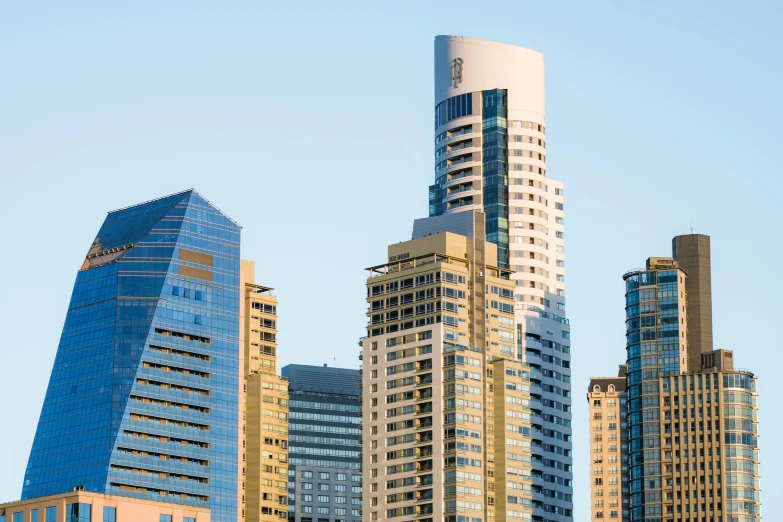 a group of tall buildings sitting next to each other, inspired by William Berra, pexels contest winner, hypermodernism, australia, late afternoon light, zoomed out view, viewed from a distance