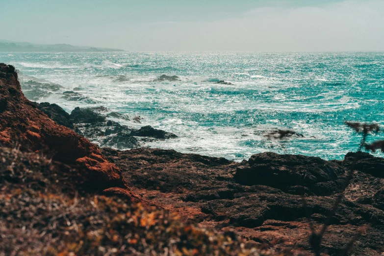 a view of the ocean from a rocky cliff, pexels contest winner, ocean spray, profile image, background image, hollister ranch