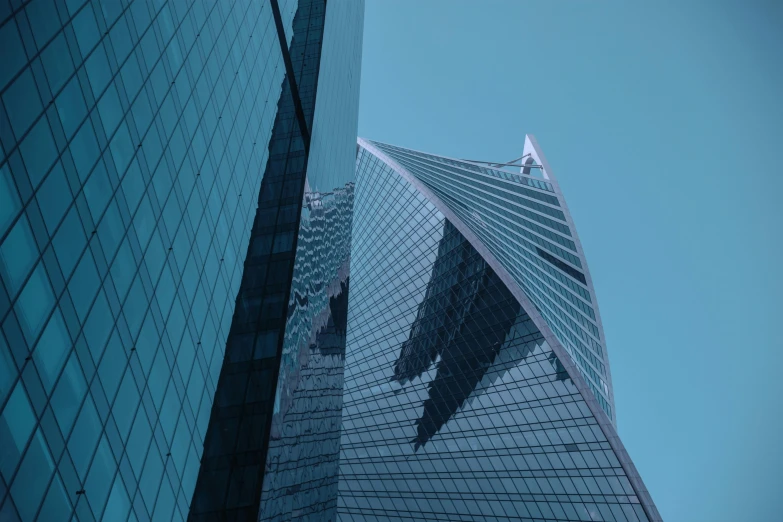 a very tall building sitting in the middle of a city, pexels contest winner, hypermodernism, in moscow centre, angular metal, high quality photo, norman foster