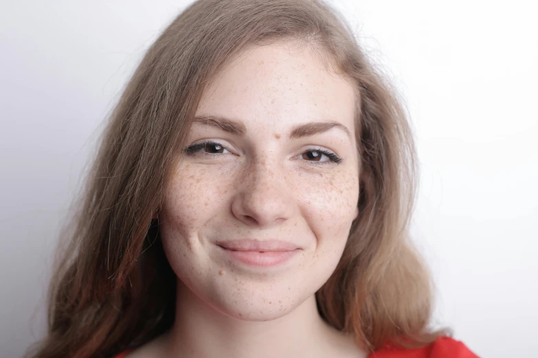 a close up of a woman with freckles on her face, trending on reddit, passport photo, anna nikonova aka newmilky, acting headshot, on grey background