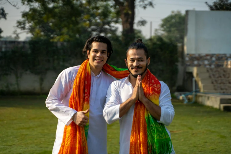 a couple of men standing next to each other, pexels contest winner, wearing a kurta, pride month, avatar image, performance