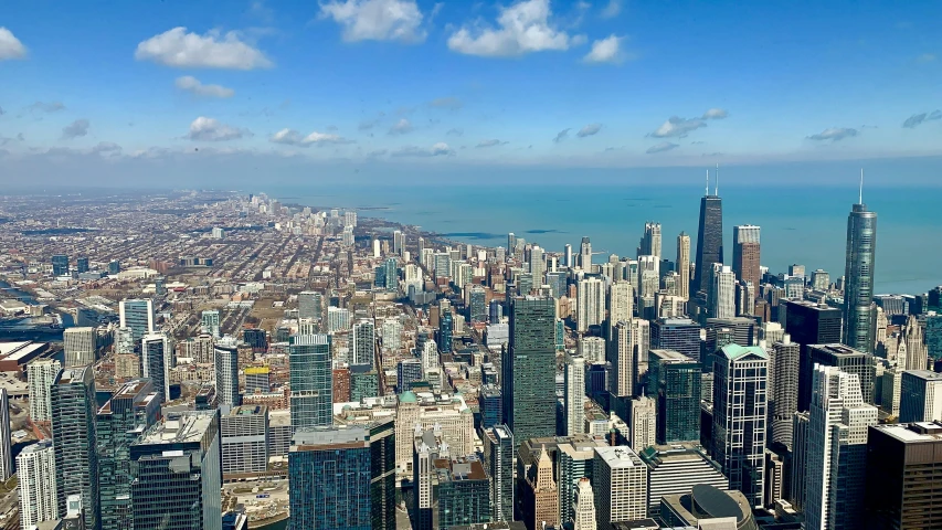 a view of a city from the top of a building, chicago skyline, 1 petapixel image, highly upvoted, beautiful day