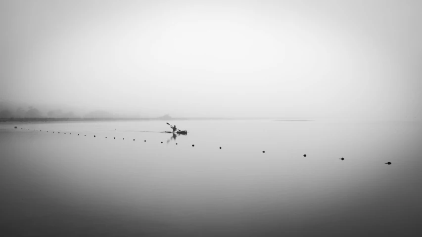 a boat floating on top of a body of water, a black and white photo, unsplash contest winner, minimalism, fisherman, white fog painting, zezhou chen, hunting