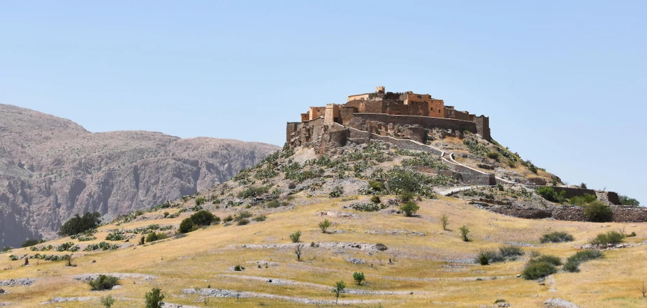 a hill with a castle on top of it, by Abdullah Gërguri, pexels contest winner, les nabis, john pawson, kurdistan, promo image, exterior