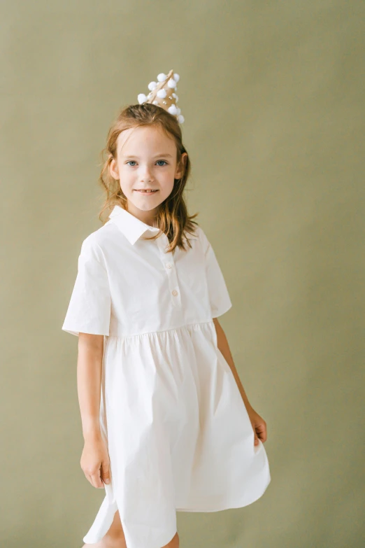 a little girl wearing a white dress and a flower in her hair, an album cover, inspired by Elsa Beskow, unsplash, collared shirt, fullbody view, simple cream dress, high resolution product photo