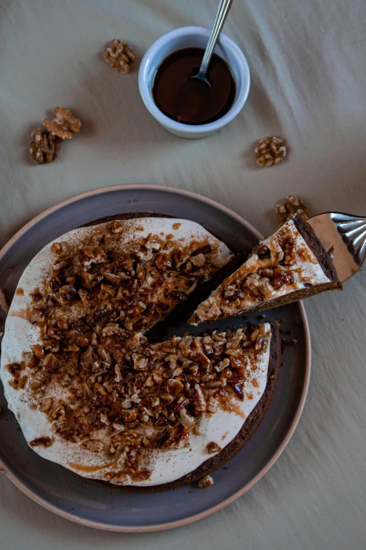 a close up of a plate of food on a table, walnuts, cake, profile image, flat lay