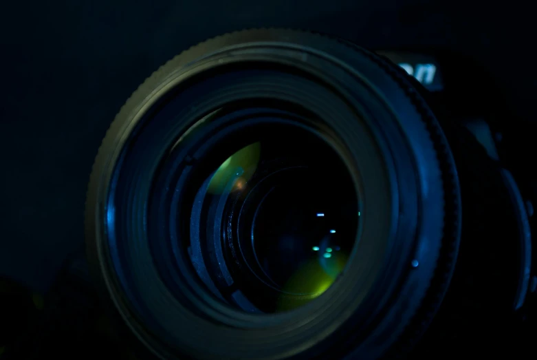 a close up of a camera lens in a dark room, pexels contest winner, night time footage, wide angle lens. 8 k, megapixel, prime lense)