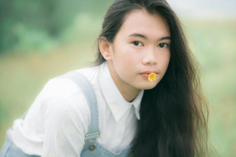 a girl with a flower in her mouth, by Tan Ting-pho, pexels contest winner, portrait of normal teenage girl, slight yellow hue, 🤤 girl portrait, headshot profile picture