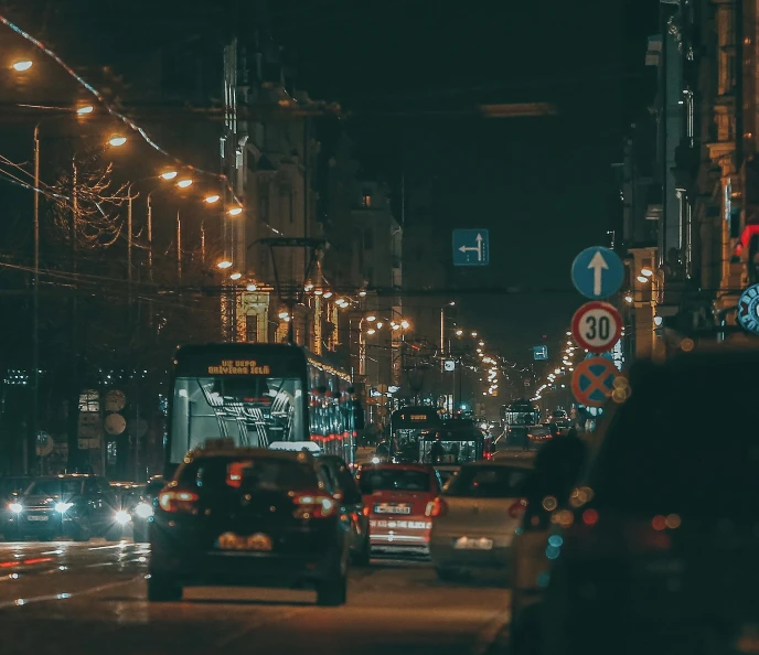 a city street filled with lots of traffic at night, by Adam Marczyński, pexels contest winner, under street lamp, thumbnail, headlights turned on, moscow