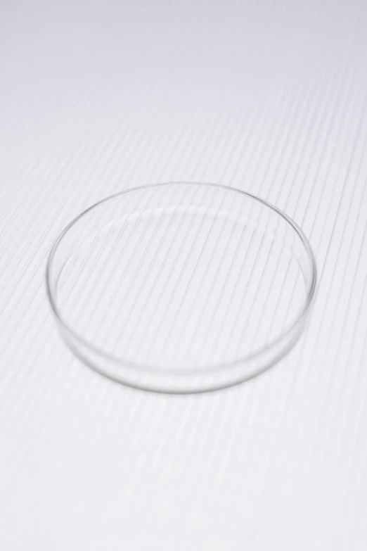 a ring sitting on top of a piece of paper, a microscopic photo, superflat, glass tableware, sigma 1/6. 50 mm, product introduction photo, round narrow chin