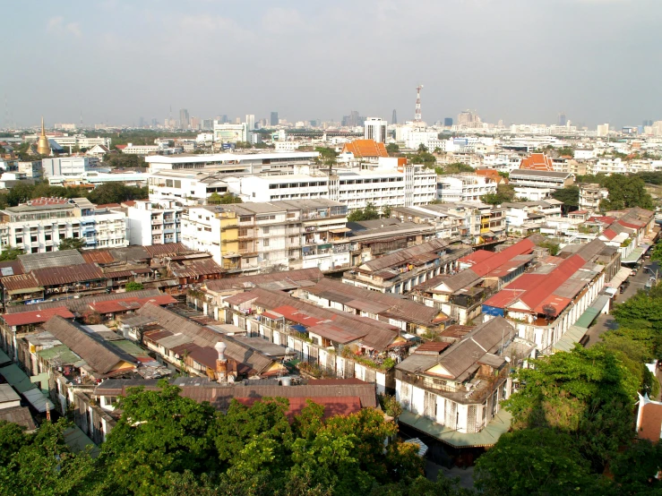 an aerial view of a city with lots of buildings, thai architecture, brown, rectangular, colonial