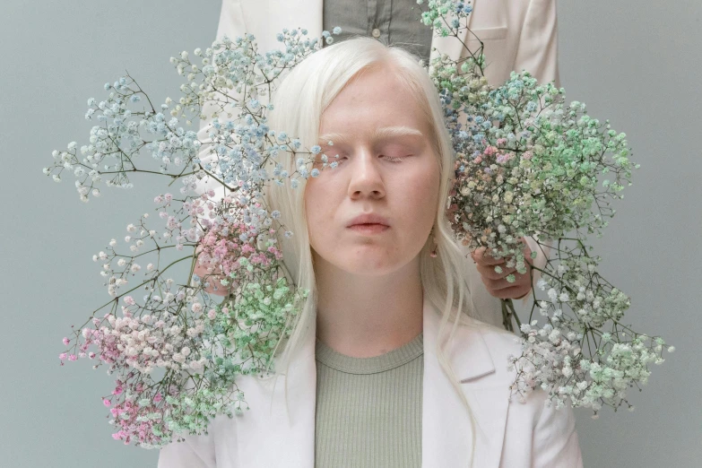 a woman with a bunch of flowers on her head, an album cover, inspired by Elsa Bleda, trending on unsplash, aestheticism, intense albino, still from the movie ex machina, nordic pastel colors, eero aarnio