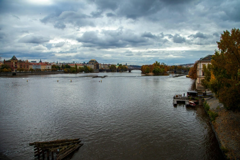 a body of water with a bunch of boats in it, by Antoni Brodowski, pexels contest winner, renaissance, prague, cloudy day, olafur eliasson, during autumn