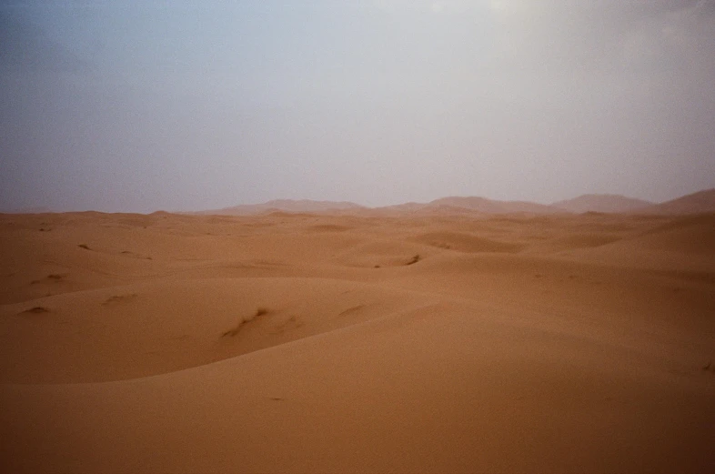 there is no image here to provide a caption for, an album cover, inspired by Scarlett Hooft Graafland, flickr, les nabis, sand - colored walls, the sky is a faint misty red hue, f 1.4 kodak portra, in an arena in movie dune-2021