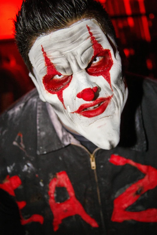 a close up of a person wearing a clown mask, posing for a picture, large red eyes!!!, haunted house themed, walking down