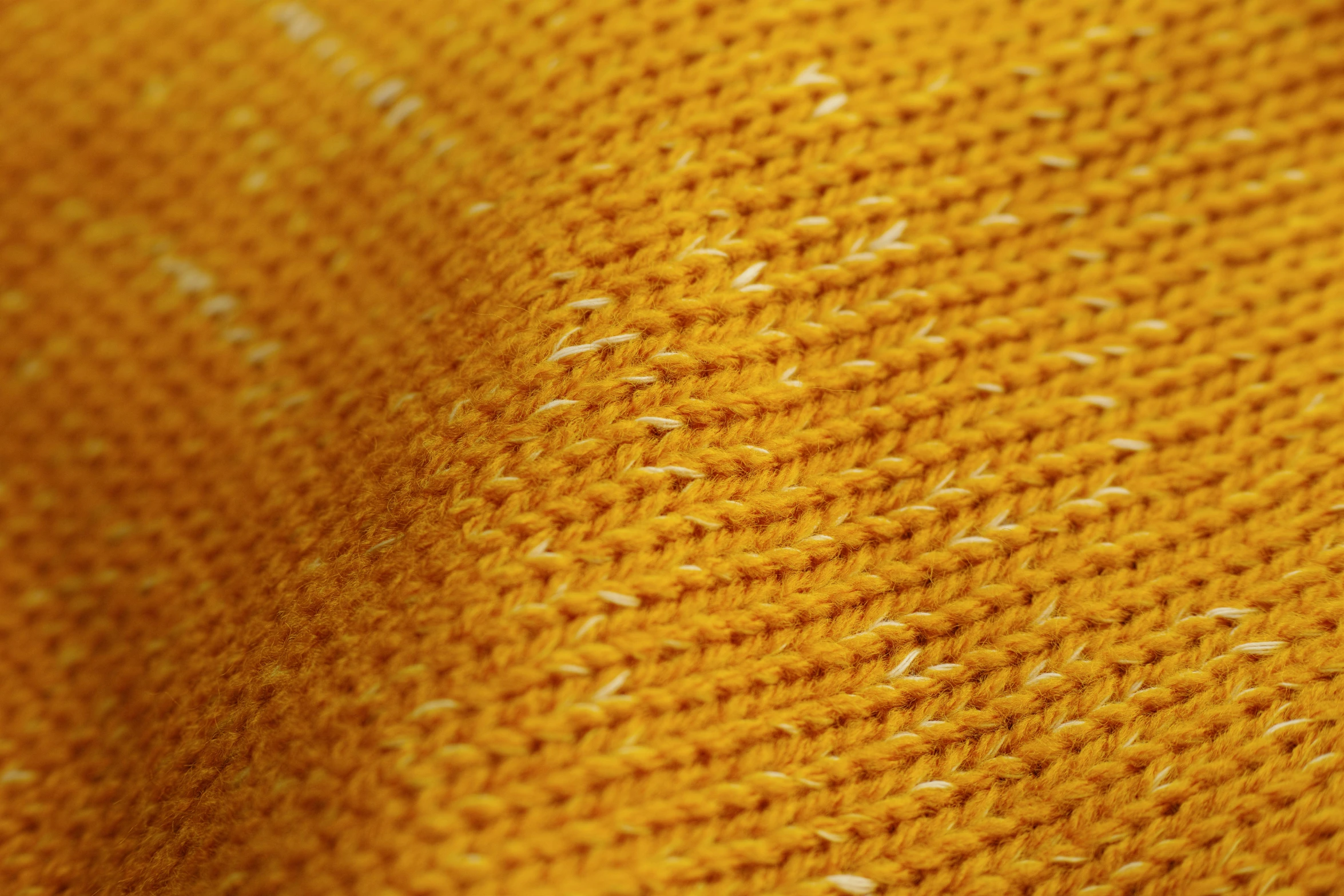 a close up of a yellow knitted sweater, a stipple, by Thomas Häfner, cotton fabric, yellow-orange, low detail, gold