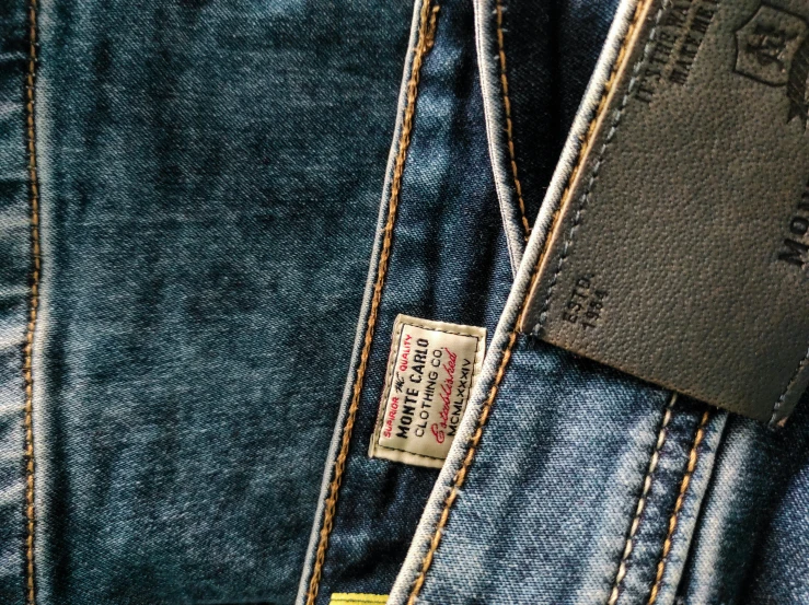 a close up of a pair of jeans, by Tom Wänerstrand, unsplash, vintage levi ’ s ad, highly detailed labeled, shot on sony a 7, a high angle shot