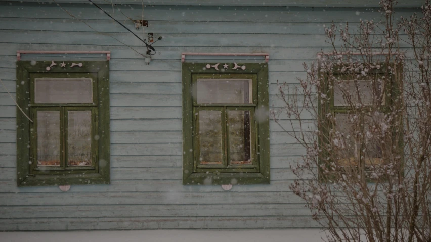 a couple of windows sitting on the side of a building, inspired by Isaac Levitan, pexels contest winner, snowstorm ::5, muted green, russian village, background image