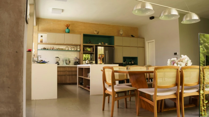 a dining room filled with lots of wooden furniture, inspired by Fernando Gerassi, unsplash, light and space, kitchen counter, a green, 1960s-era, concrete hitech interior