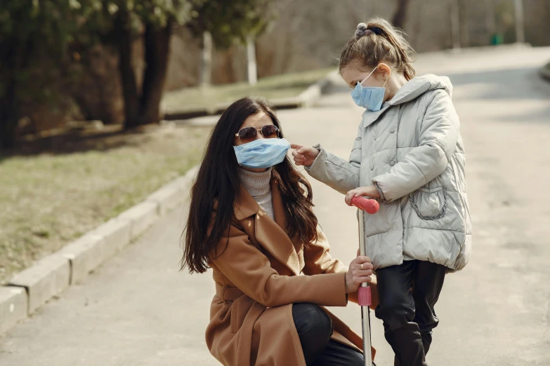 a woman standing next to a little girl on a scooter, trending on pexels, surgical mask covering mouth, avatar image, thumbnail, amazing beauty