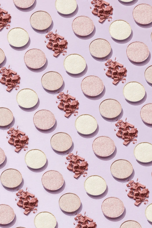 a bunch of coins sitting on top of a pink surface, eyeshadow, detailed product image, multiple lights, vanilla