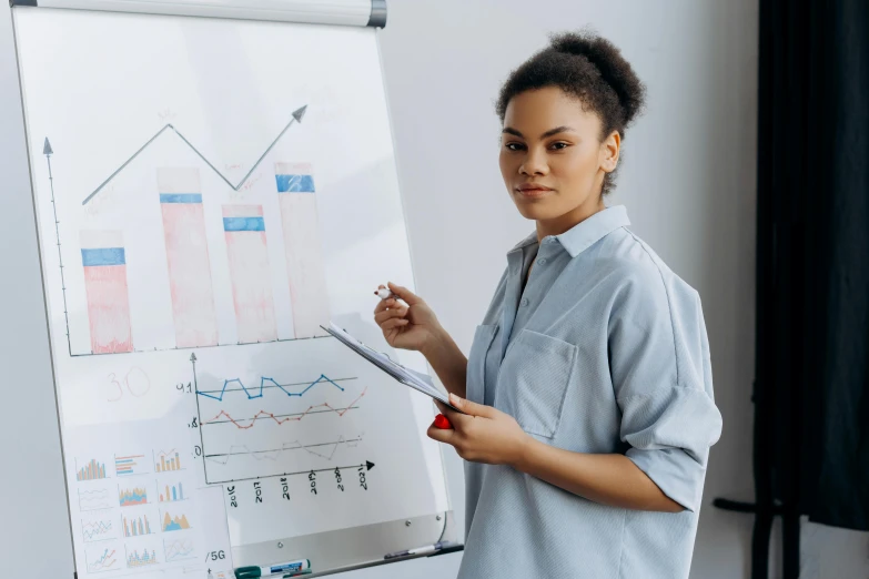 a woman standing in front of a white board holding a clipboard, analytical art, graphs, realistic »