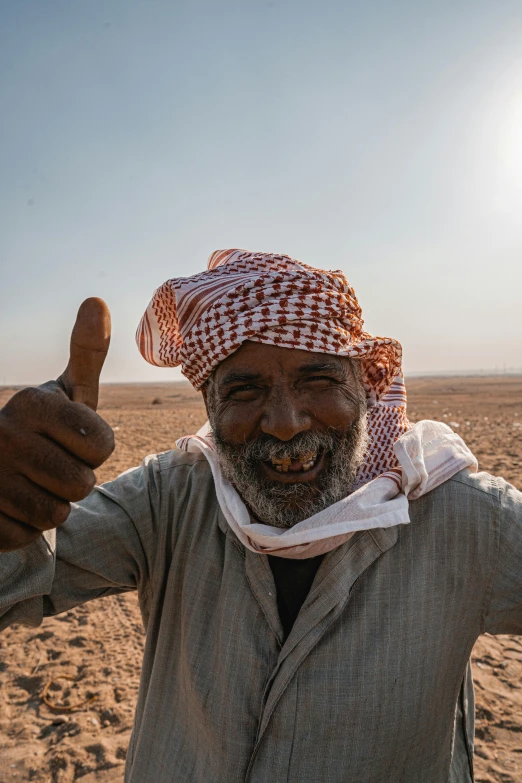 a man giving a thumbs up in the desert, dau-al-set, photograph taken in 2 0 2 0, farmer, fan favorite, very very happy!