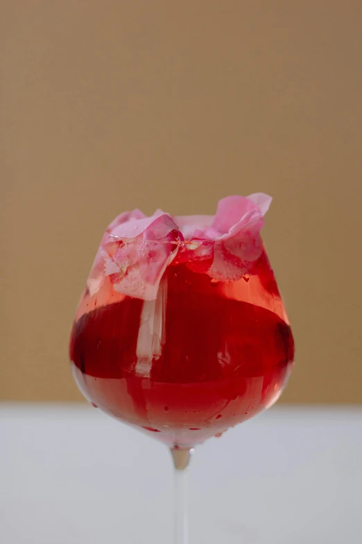 a close up of a wine glass on a table, baroque hibiscus queen, slush, made of lab tissue, natural point rose'