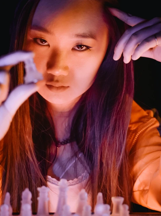 a close up of a person holding a cell phone, an album cover, inspired by Feng Zhu, holography, working in her science lab, intense expression, soft lighting from above, halloween