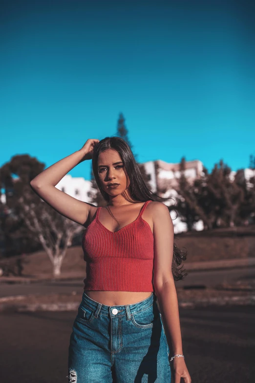 a woman in a red top and blue jeans, by Alexis Grimou, pexels contest winner, wearing a crop top, avatar image, marbella, cute young woman