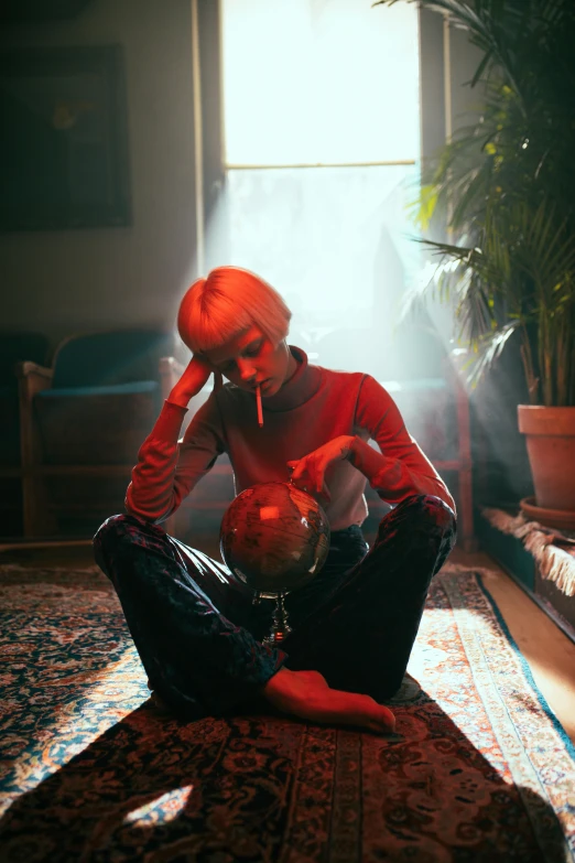 a man sitting on the floor smoking a cigarette, an album cover, inspired by Elsa Bleda, magic realism, wearing a red turtleneck sweater, girl with short white hair, holding a crystal ball, portrait a woman like reol