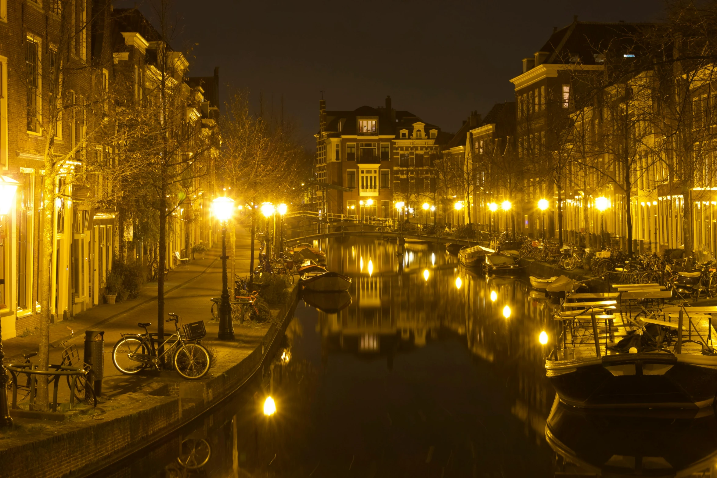 a canal in the middle of a city at night, by Jan Tengnagel, as photograph, wim crouwel, photograph