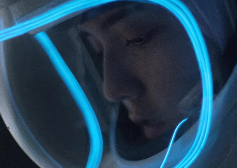 a close up of a person wearing a helmet, a hologram, inspired by Beeple, pexels contest winner, li bingbing, glowing spacesuit, aura jared and wires, still from the movie