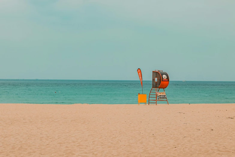 a lifeguard stand on a beach next to the ocean, a photo, unsplash contest winner, cyan and orange, hight decorated, photo 8 k, medium format