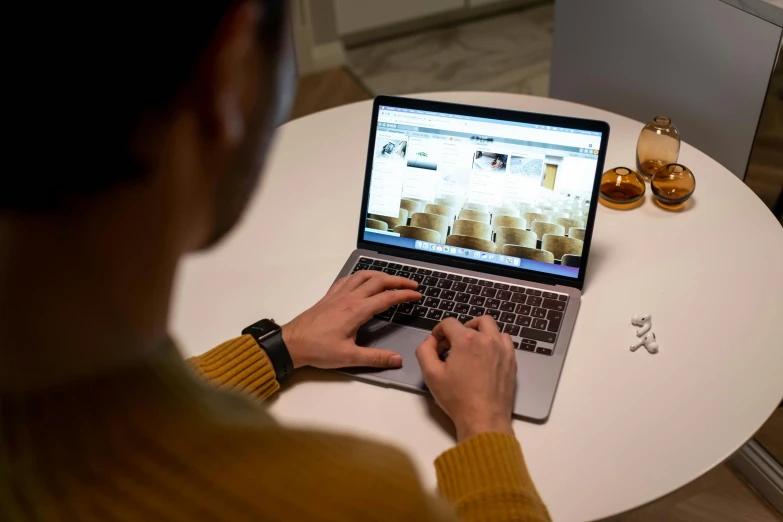 a person sitting at a table with a laptop, pexels contest winner, arbeitsrat für kunst, close up to the screen, bottom angle, at home, profile image