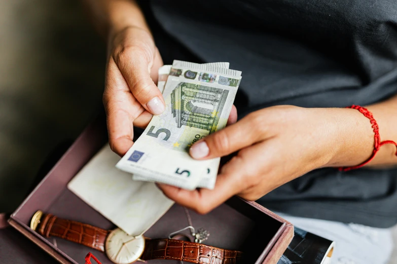 a person holding a wallet with money in it, pexels contest winner, arbeitsrat für kunst, avatar image, cash on a sidetable, vesa-matti loiri, thumbnail