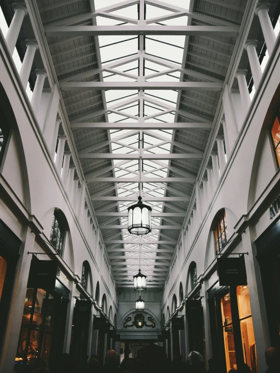 a black and white photo of the inside of a building, by Robbie Trevino, unsplash contest winner, in magnificent shopping mall, photograph of san francisco, preserved historical, color photo