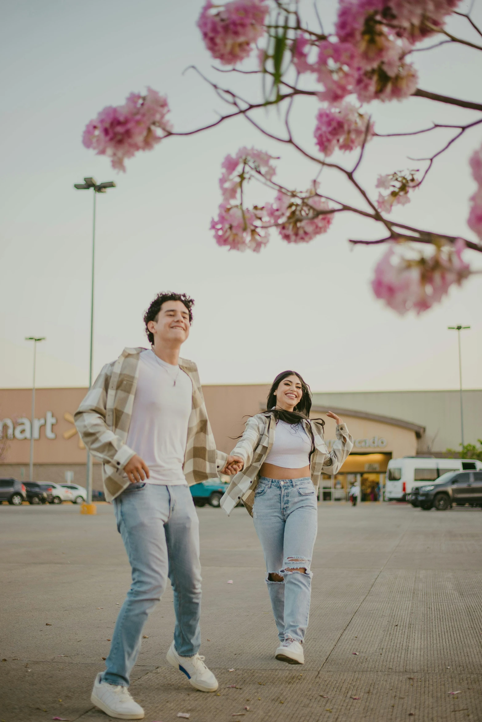 a man and a woman walking in a parking lot, spring vibes, walmart, there's flowers everywhere, asher duran