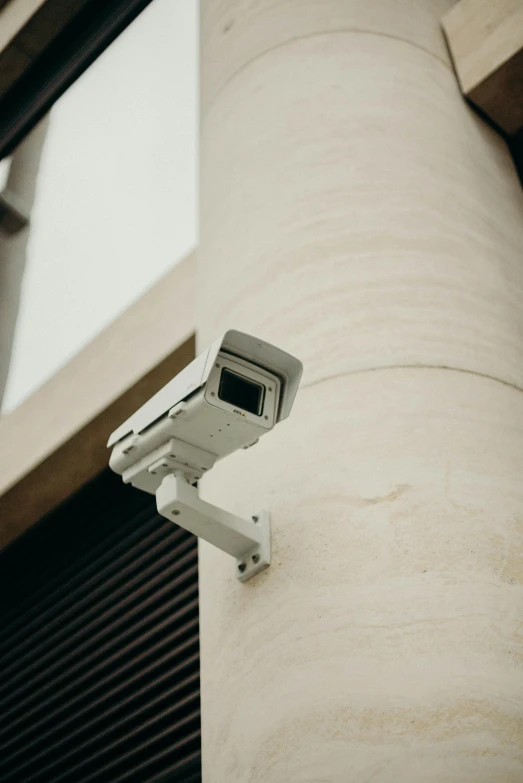 a security camera mounted on the side of a building, a cartoon, unsplash, renaissance, government archive photograph, high definition image, vhs colour photography, hyperdetailed photo
