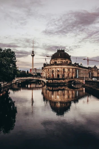 a large building next to a body of water, pexels contest winner, berlin secession, fan favorite, 🚿🗝📝